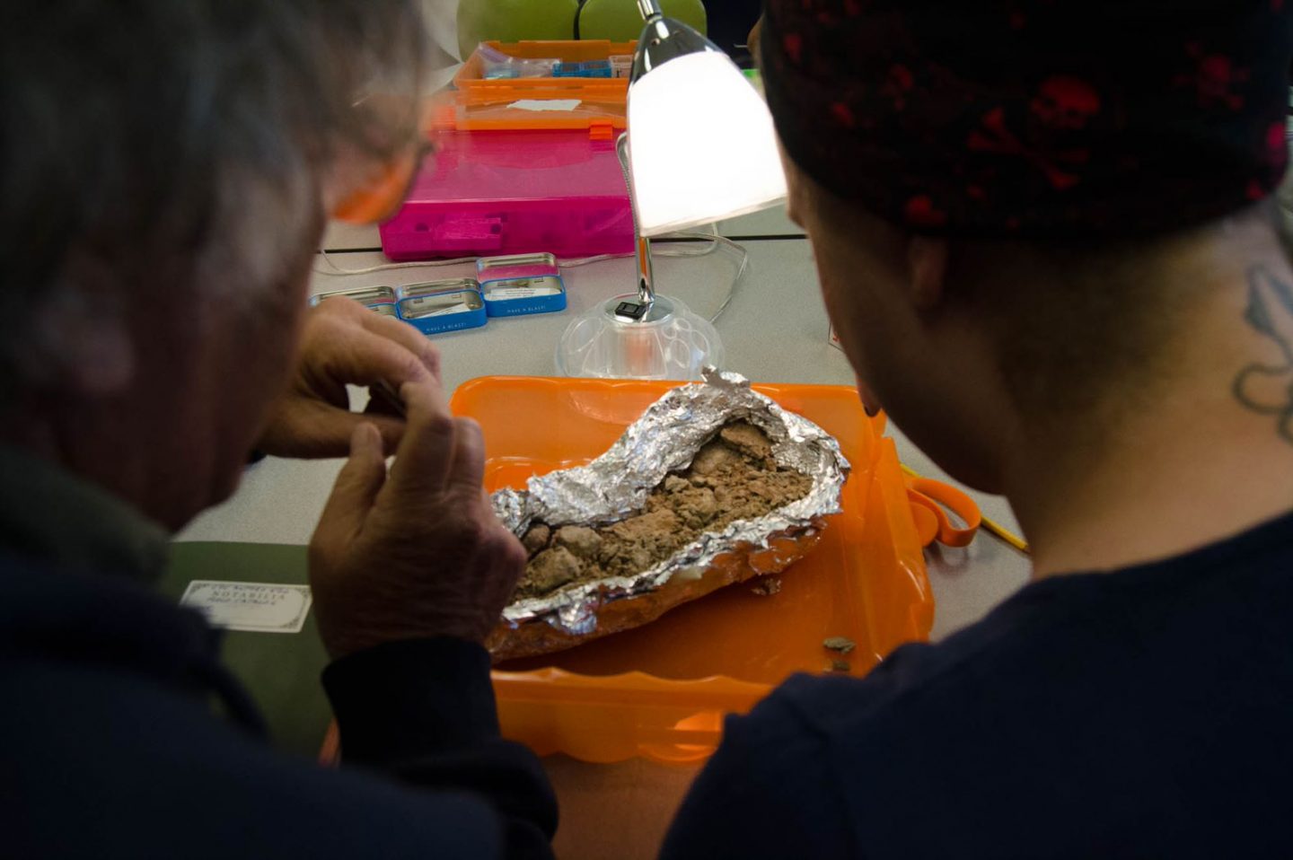 Unwrapping soil from tinfoil to examine in the lab