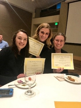 Elizabeth Larson, Carson Black, and Rachel Bockrath receiving Awards for their projects at the 2018 Celebrate Undergraduate Research and Creativity