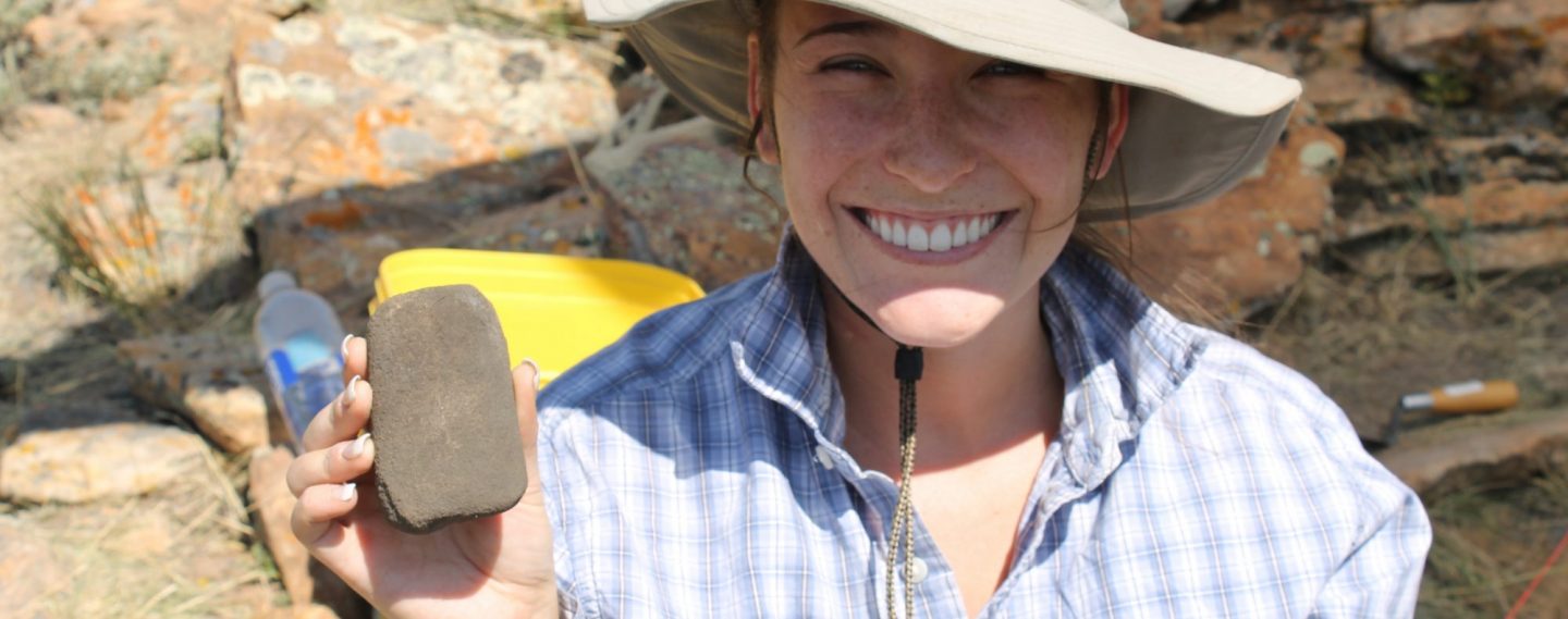 Ashley Packard holding a smooth stone