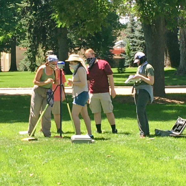 TA and students setting up GPS field equipment