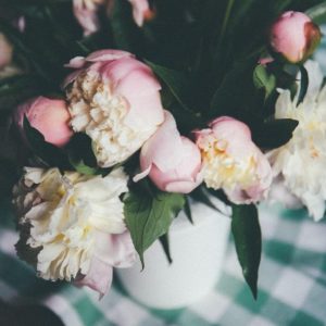 Peonies in a vase on a table