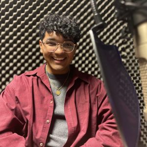 Ali Niaz sits in a podcast studio at Colorado State University, Feb. 6, 2024.