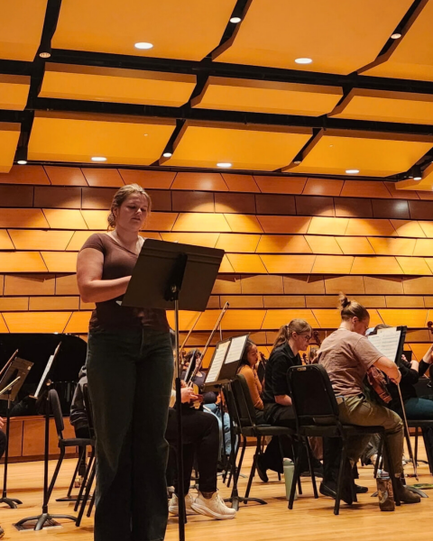 Lindsey Zamboni-Cutter reads a poem at CSU music event featuring student poetry.