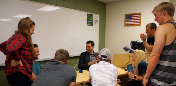 Robert Jordan speaking with students during class