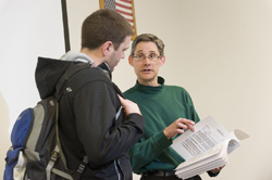 Jared Orsi speaking with a student 