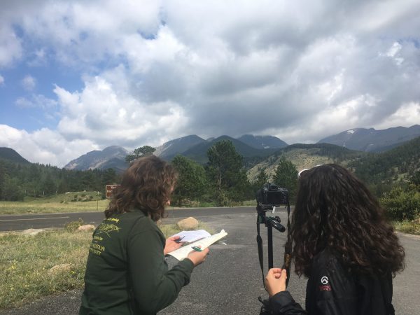 Students photographing Rocky Mountaint National Park and taking historical notes