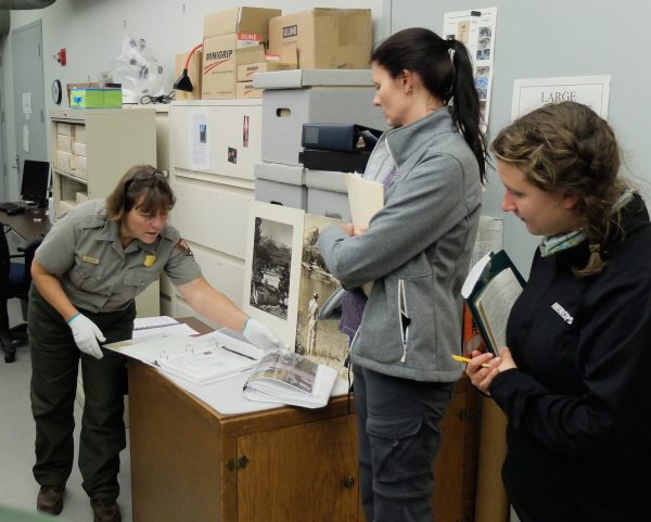 A student and PLHC Admin, Brenda Todd, work with a conservator at Rocky Mountain National Park