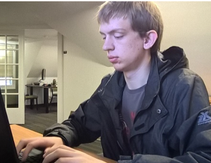Logan Haas typing on a laptop