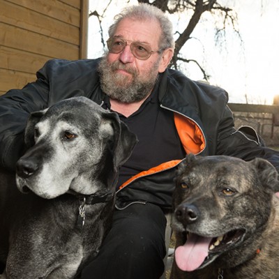 Rollin relaxes at home with his dogs, Molly and King