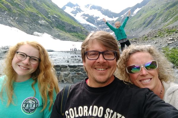 Paul DeMaret on vacation in the mountains with his wife and two daughters