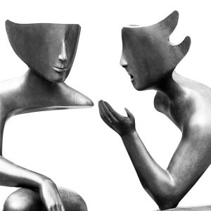 Two mannequin posed as if they are speaking conversationally to each other