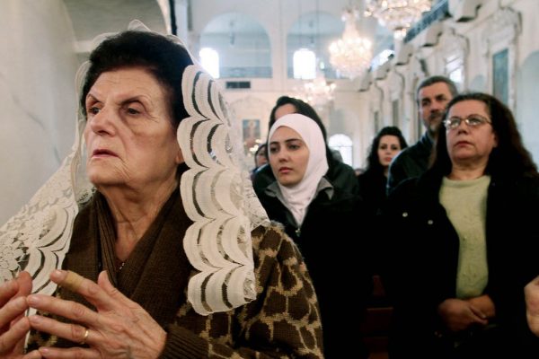 Syrian women praying at a Greek Orthodox church