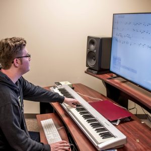 Derek Summers using the equipment to compose an original piece