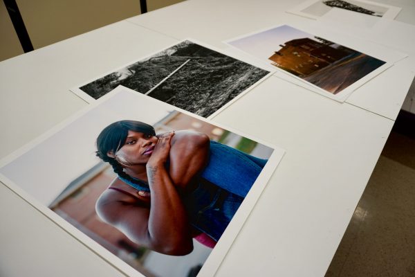 Laying out photography for an exhibit at the Gregory Allicar Museum of Art
