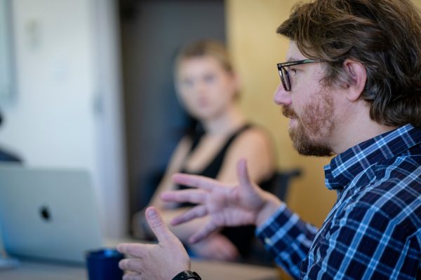 Collin Rice speaks to students in class