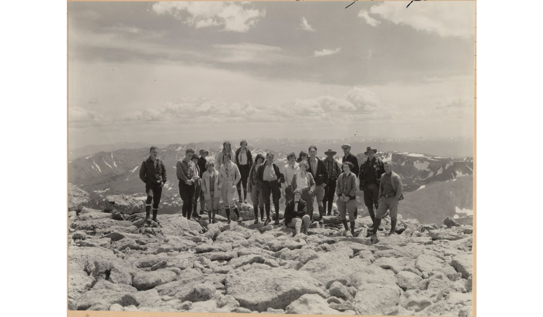 Historical photo of white hiking group submitting Long's Peak in 1927
