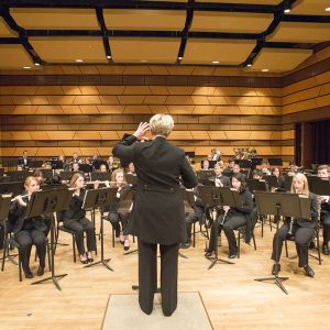 Rebecca Phillips pictured conducting the Wind Symphony