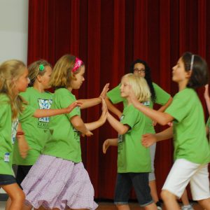 Children dance to a folk song during the Master of Music Music Education Specialization Kodaly Option summer session.