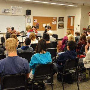 Borromeo String Quartet pictured performing in a classroom