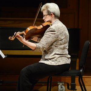 Margaret Miller pictured playing the viola