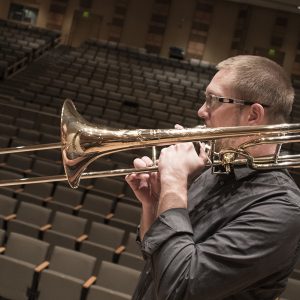 Chris Van Hof pictured playing trombone