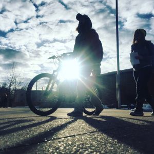Student pictured walking a bike