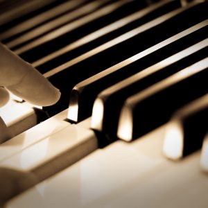Close up of piano keys being played