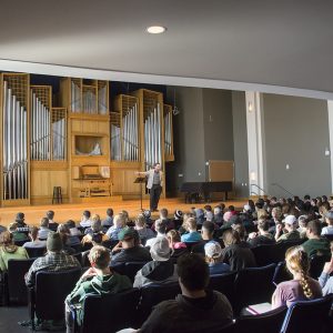 Professor Stuart Dameron pictured addressing the music appreciation students in the Organ Recital Hall