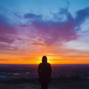 A CSU student watches the sun rise