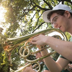 Student pictured playing brass instrument