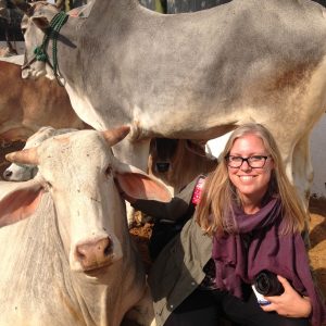 Kelsi Nagy with a cow in India