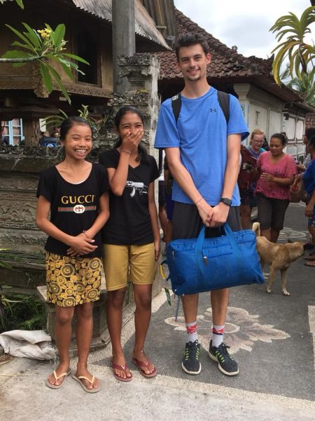 Spencer Sheaman standing with two women in Bali