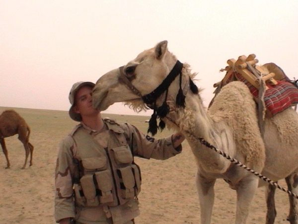 soldier (Time Milbrodt) in the desert with a camel