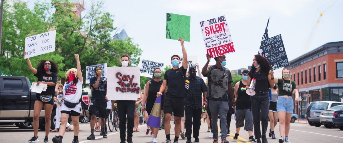 students marching at rally