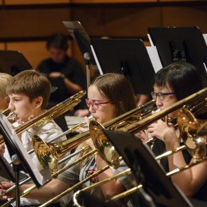 Trombone section of the Middle School Outreach Ensemble band pictured