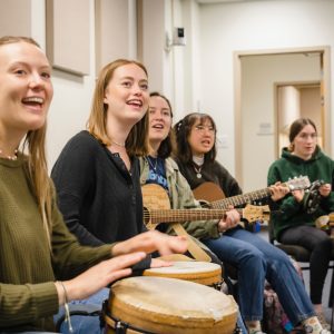 Several CSU Music Therapy students playing drums