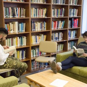 Two students reading in the Jann Benson Ethics Center