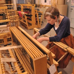 Student weaving in the Fibers Studio