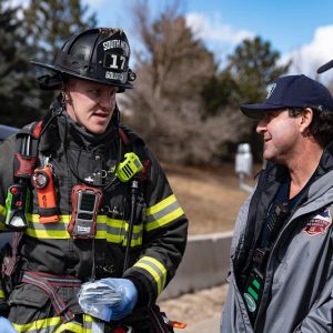 Former CSU football player turned firefighter, Zack Golditch (B.A., ’17), speaking with residents of Aurora, Colorado.