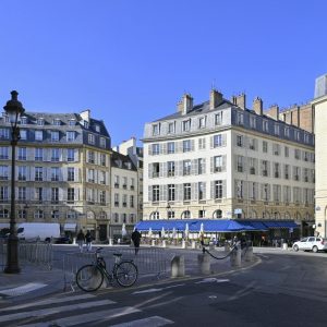 Traffic circle in Paris, France with three buildings designed in classic French architecture