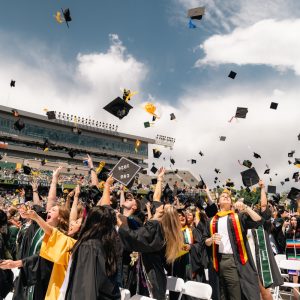 Students throwing caps