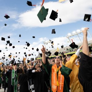 Graduates throwing caps