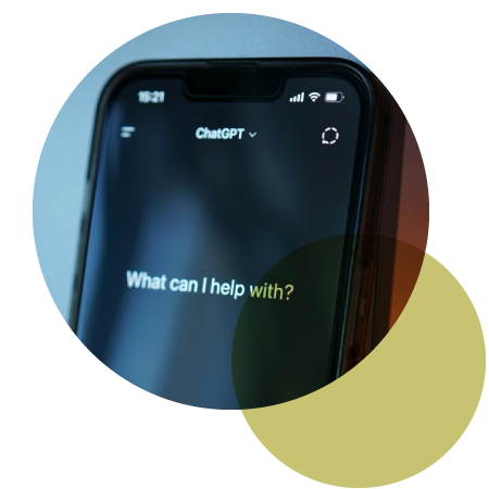 Cell phone displaying ChatGPT app asking what can I help with?
