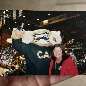 Brady O’Neill dressed as CAM the Ram poses with his mother inside Moby Arena during his time as a CSU student.