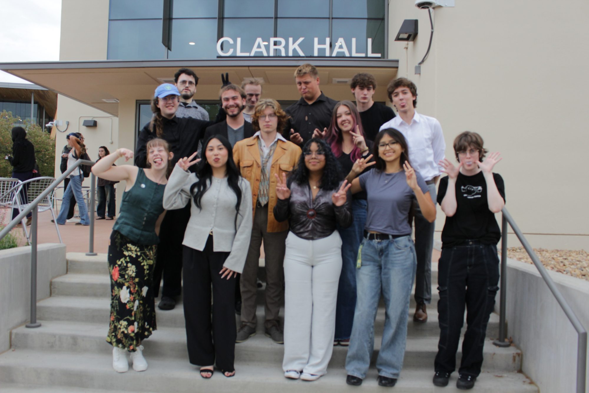 CLARC student members posing in front of Clark Hall making silly faces