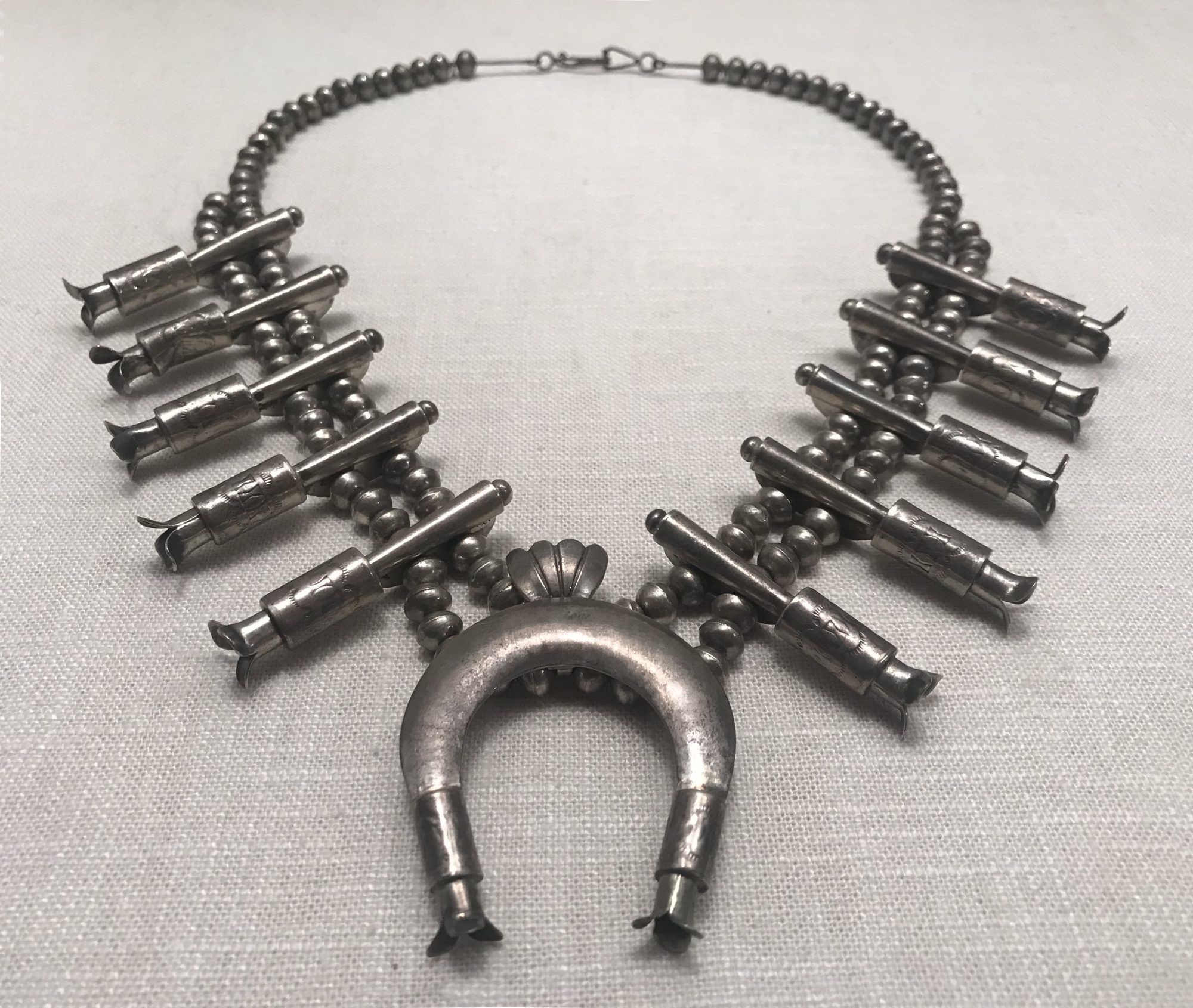 Bi’éé’ Dóó Bi’ootseed: Navajo Clothing and Jewelry